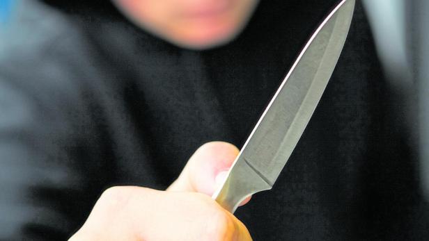 Teenage Boy Brandishing Knife