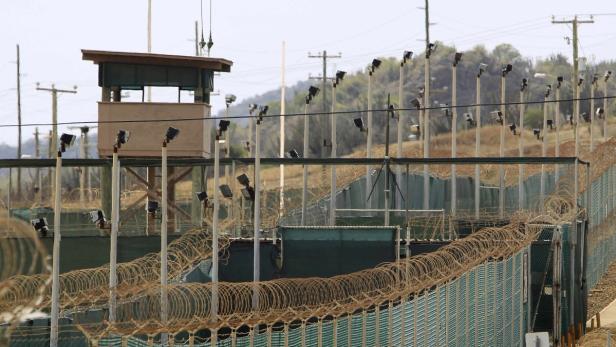 The exterior of Camp Delta is seen at the U.S. Naval Base at Guantanamo Bay in this file photo taken March 6, 2013. With his renewed vow to close the detention camp for foreign terrorism suspects at Guantanamo Bay, U.S. President Barack Obama has effectively assigned himself a list of possible ways to take the prison&#039;s population down from 166 to zero. REUTERS/Bob Strong/Files (CUBA - Tags: POLITICS MILITARY CRIME LAW)