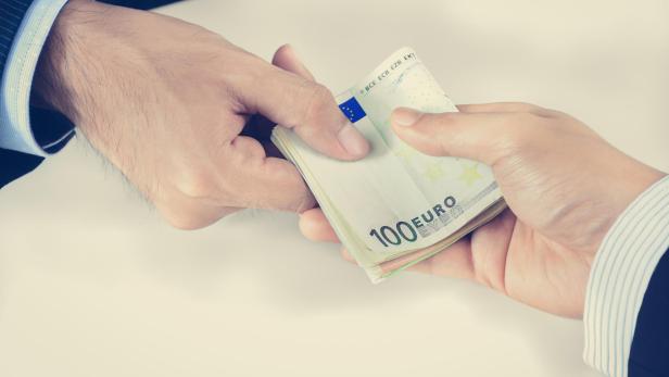 Businessman hands passing money, Euro currency (EUR)