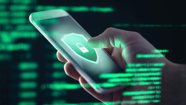 Mobile phone personal data and cyber security threat concept. Cellphone fraud. Smartphone hacked with illegal spyware, ransomware or trojan software. Hacker doing online scam.