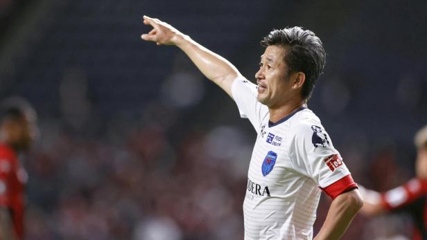 FILE PHOTO: Yokohama FC's Japanese striker Kazuyoshi Miura gestures during J. League YBC Levain Cup soccer match against Hokkaido Consadole Sapporo in Sapporo, Japan
