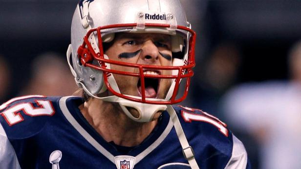FILE PHOTO: New England Patriots quarterback Tom Brady celebrates his second quarter touchdown pass against the New York Giants in the NFL Super Bowl XLVI football game in Indianapolis