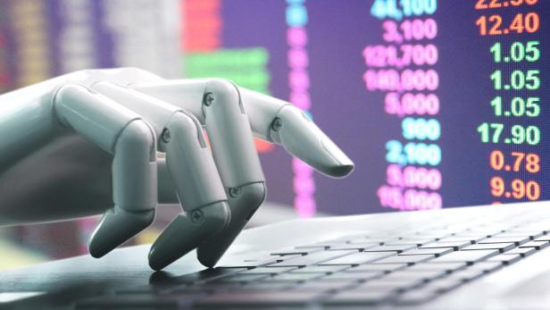 Chatbot robot hand pressing computer keyboard enter of Investment in the puppet market