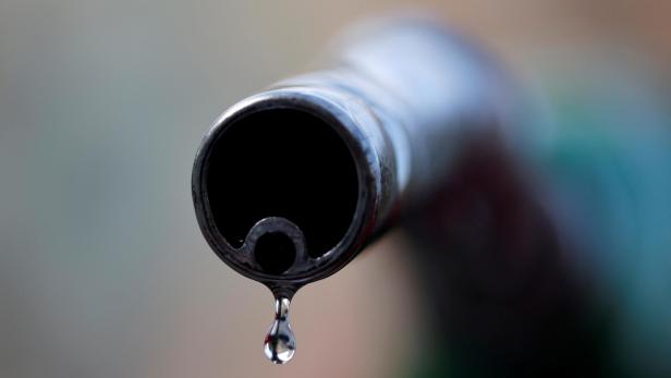 FILE PHOTO: A drop of diesel is seen at the tip of a nozzle in a petrol station in Nice