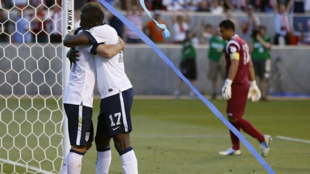 Fabian Johnson (L) of the U.S. celebrates with compatriot Josy Altidore (17) after Altidore scored a goal against Honduras during their 2014 World Cup qualifying soccer match in Salt Lake City, Utah, June 18, 2013. REUTERS/Jim Urquhart (UNITED STATES - Tags: SPORT SOCCER)