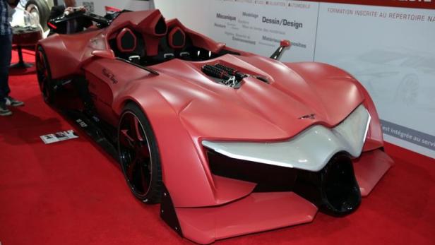 Ein rosafarbenes Sbarro-Sportwagenmodell auf einer Automobilausstellung.