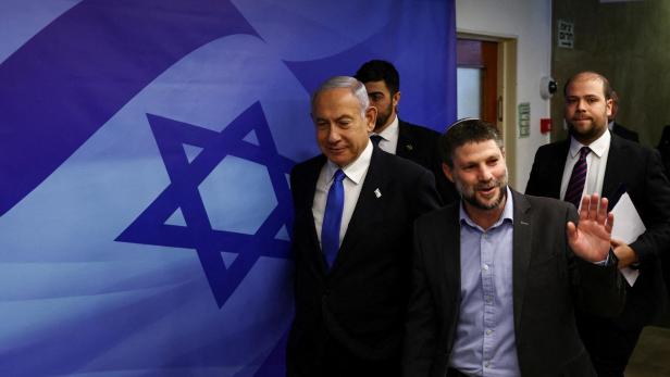 FILE PHOTO: Israeli Prime Minister Benjamin Netanyahu and Finance Minister Bezalel Smotrich arrive to attend a cabinet meeting at the Prime Minister's office in Jerusalem