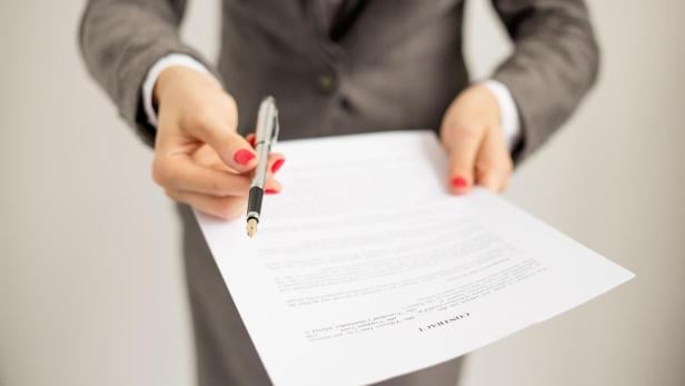 Woman offering to sign papers