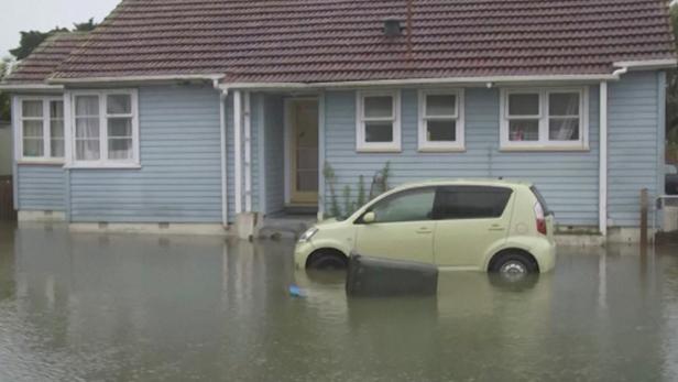 A car stands in flood water, in Auckland