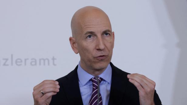 Austrian Economy Minister Kocher attends a news conference in Vienna
