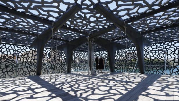 epa03741702 Two women look the sea views from the Museum of the civilizations of Europe and Mediterranean (MuCEM) in Marseille, southern France, 12 June 2013. The MuCEM was inaugurated by French President Francois Hollande on 04 June 2013 as part of &#039;Marseille-Provence European Capital of Culture&#039;. EPA/GUILLAUME HORCAJUELO