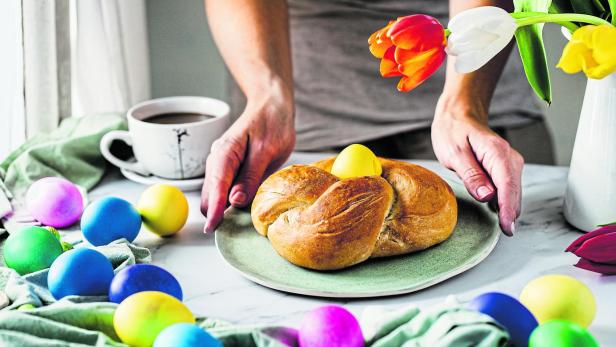 Close-up of woman serving breakfast for Easter