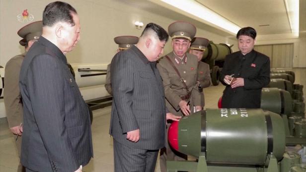 North Korean leader Kim Jong Un inspects nuclear warheads at an undisclosed location