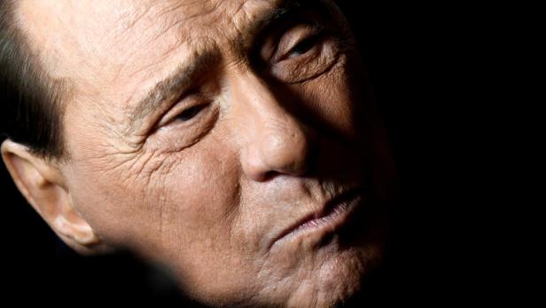 FILE PHOTO: Former Italian Prime Minister and leader of the Forza Italia party Silvio Berlusconi attends a rally ahead of a regional election in Emilia-Romagna, in Ravenna