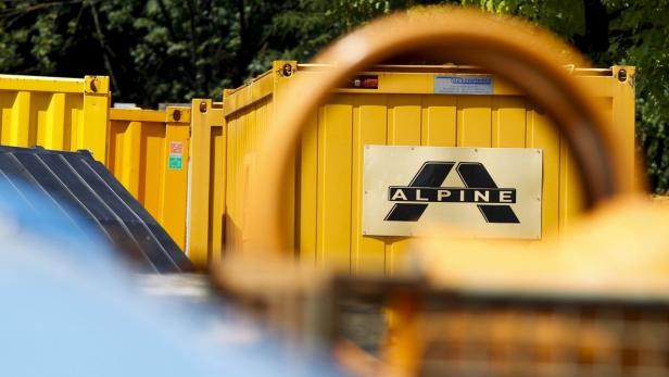 The logo of Austrian construction company Alpine is pictured on containers at a construction site on the A12 highway in the western Austrian city of Hall in Tirol, June 19, 2013. Alpine, the Austrian unit of Spanish construction group FCC, failed to strike a deal with creditors to reorganise its debt and said on Tuesday that insolvency proceedings were &quot;imminent.&quot; REUTERS/Dominic Ebenbichler (AUSTRIA - Tags: BUSINESS CONSTRUCTION LOGO)