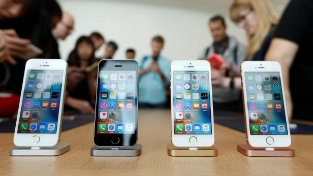 FILE PHOTO: The new iPhone SE is seen on display during an event at the Apple headquarters in Cupertino, California