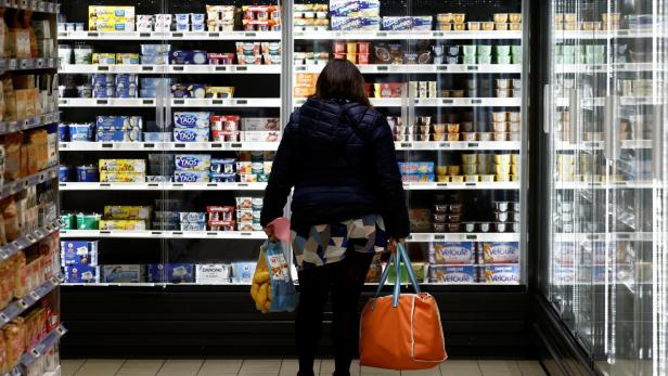 Customers shop in a supermarket in La Verrie