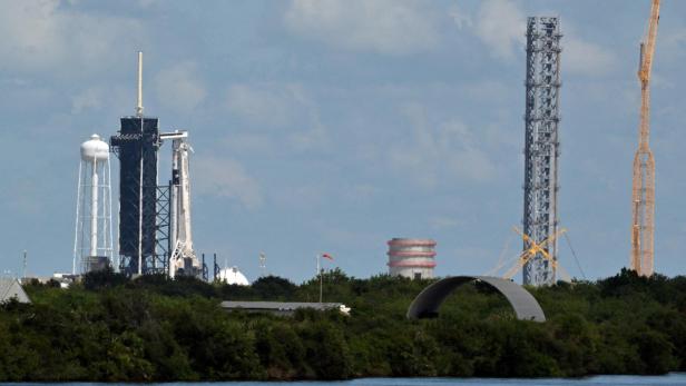 FILE PHOTO: A SpaceX Falcon 9 rocket with the Crew Dragon capsule stands on Pad-39A in preparation for a mission to carry four crew members to the International Space Station