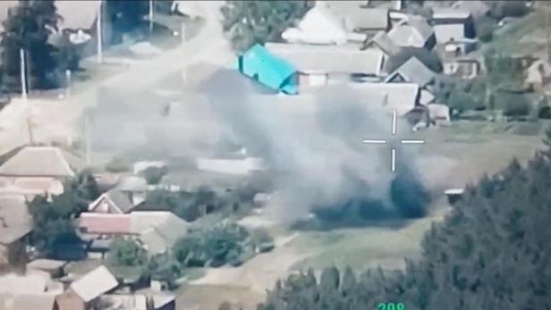 FILE PHOTO: A still image from a drone footage released by Freedom of Russia Legion shows what they claim is a destruction of Russian military targets near Novaya Tavolzhanka