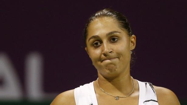 Tamira Paszek of Austria reacts after losing a point against Ana Ivanovic of Serbia during their women&#039;s match at the Qatar Open tennis tournament in Doha February 11, 2013. REUTERS/Fadi Al-Assaad (QATAR - Tags: SPORT TENNIS)