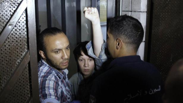 Marguerite Stern of France, a member of the women&#039;s rights group Femen, gestures after she is released from prison in Tunis June 27, 2013. A Tunisian court on Wednesday decided to release three European feminist activists who staged a topless protest in Tunis last month against the Islamist-led government. REUTERS/Zoubeir Souissi (TUNISIA - Tags: CIVIL UNREST CRIME LAW POLITICS RELIGION)