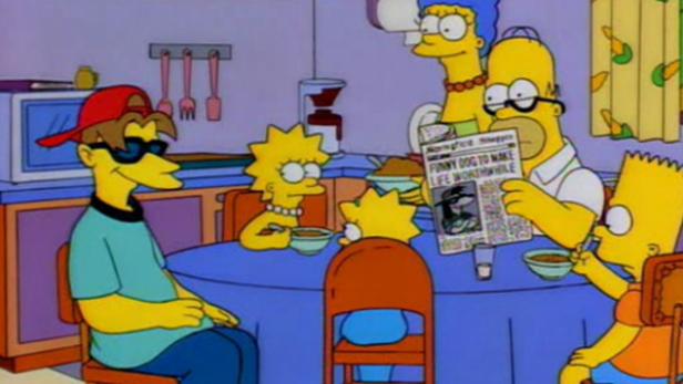 Die Simpsons sitzen am Küchentisch und essen, während Homer Zeitung liest.