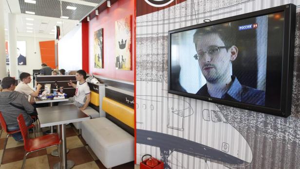 A television screen shows former U.S. spy agency contractor Edward Snowden during a news bulletin at a cafe at Moscow&#039;s Sheremetyevo airport June 26, 2013. Russian President Vladimir Putin confirmed on Tuesday a former U.S. spy agency contractor sought by the United States was in the transit area of a Moscow airport but ruled out handing him to Washington, dismissing U.S. criticisms as &quot;ravings and rubbish&quot;. REUTERS/Sergei Karpukhin (RUSSIA - Tags: POLITICS SOCIETY TRANSPORT)