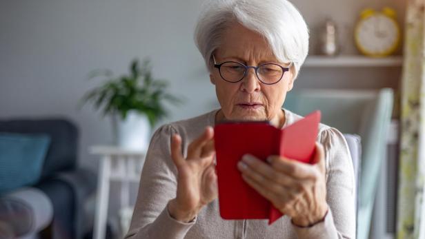 Portrait of senior woman using smartphone at home