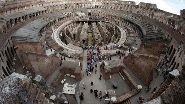 FILE PHOTO: Tourists visit the Colosseum in Rome