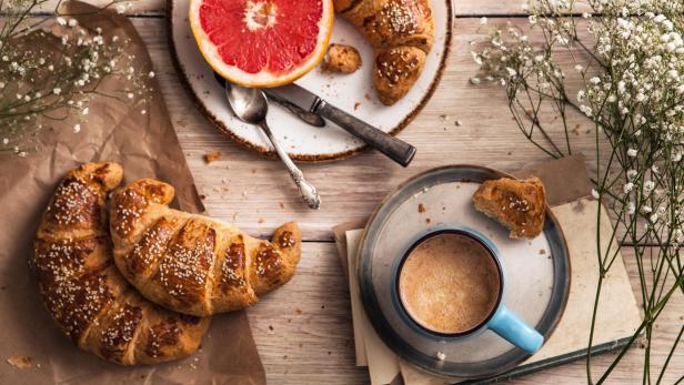 Breakfast with coffee and croissant