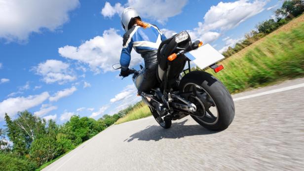 adult woman riding her motorcycle