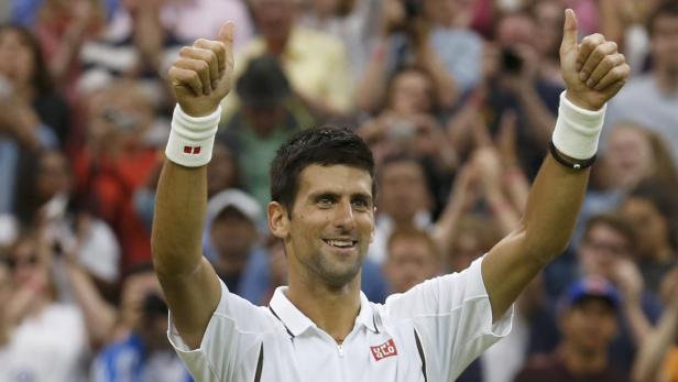 Novak Djokovic of Serbia celebrates after defeating Bobby Reynolds of the U.S. during their men&#039;s singles tennis match at the Wimbledon Tennis Championships, in London June 27, 2013. REUTERS/Suzanne Plunkett (BRITAIN - Tags: SPORT TENNIS TPX IMAGES OF THE DAY)