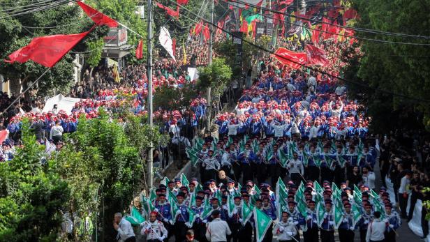 Members of Imam al-Mahdi scouts march during a religious procession to mark Ashura in Beirut's southern suburbs