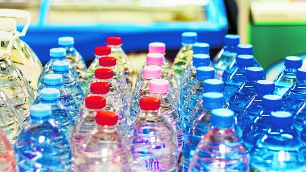 colorful caps on plastic bottles with water