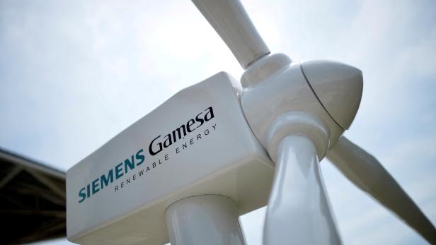 FILE PHOTO: A model of a wind turbine with the Siemens Gamesa logo is displayed outside the annual general shareholders meeting in Zamudio