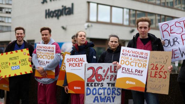FILE PHOTO: People attend a protest by junior doctors in London