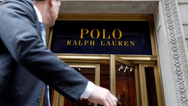 FILE PHOTO: A man walks past Ralph Lauren Corp.'s flagship Polo store on Fifth Avenue in New York
