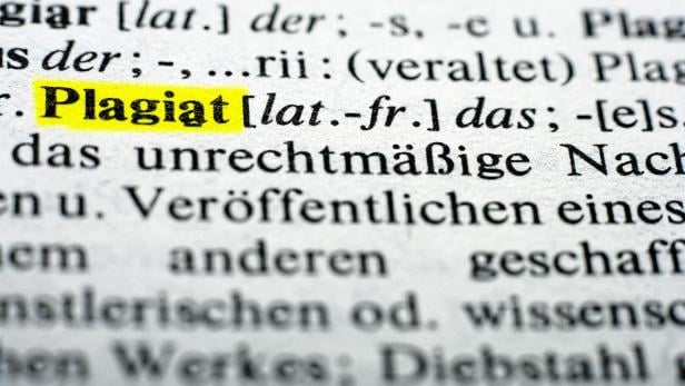 Extreme close up of english dictionary, word plagiat