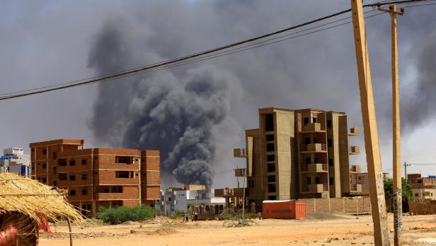 FILE PHOTO: Smoke rises above buildings after an aerial bombardment in Khartoum North