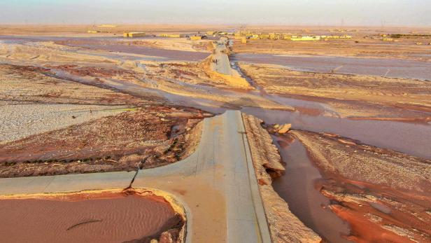 General view of flood water covering the area as a powerful storm and heavy rainfall hit Al-Mukhaili