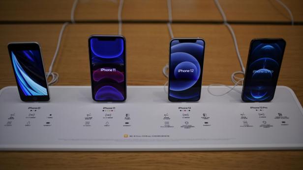 Apple's 5G iPhone 12 and iPhone 11 are seen at an Apple Store, as the coronavirus disease (COVID-19) outbreak continues in Shanghai