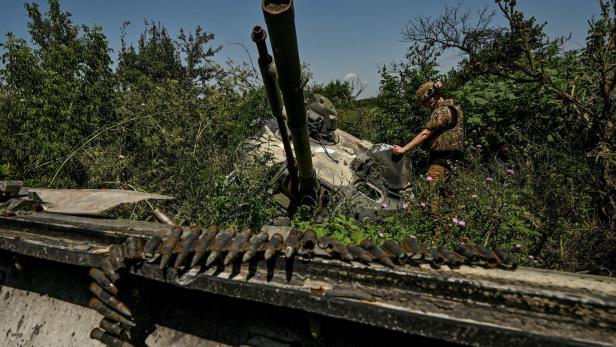 FILE PHOTO: Ukrainian serviceman inspects a turret of a destroyed Russian BMP-3 infantry fighting vehicle in the village of Novodarivka, Ukraine