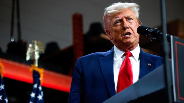 Former U.S. President and Republican presidential candidate Trump addresses auto workers as he skips the second GOP debate, in Clinton Township, Michigan