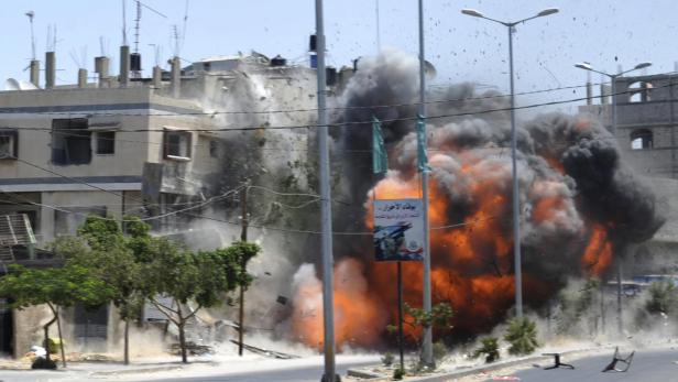 A view of what witnesses said was an explosion caused by an Israeli air strike on a house in Gaza City