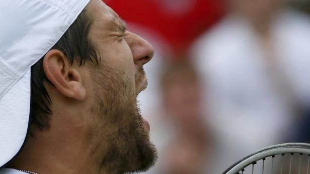 Jurgen Melzer of Austria reacts during his men&#039;s singles tennis match against Jerzy Janowicz of Poland at the Wimbledon Tennis Championships, in London July 1, 2013. REUTERS/Stefan Wermuth (BRITAIN - Tags: SPORT TENNIS)