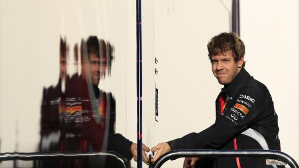 Red Bull Formula One driver Sebastian Vettel of Germany is seen in the paddock during a training session at the Jerez racetrack in southern Spain February 7, 2013. REUTERS/Marcelo del Pozo (SPAIN - Tags: SPORT MOTORSPORT)