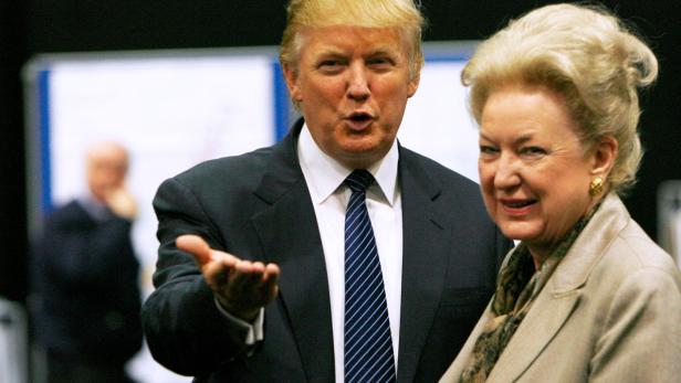 FILE PHOTO: Donald Trump gestures as he stands next to his sister Maryanne Trump Barry, during a break in proceedings of the Aberdeenshire Council inquiry into his plans for a golf resort, Aberdeen