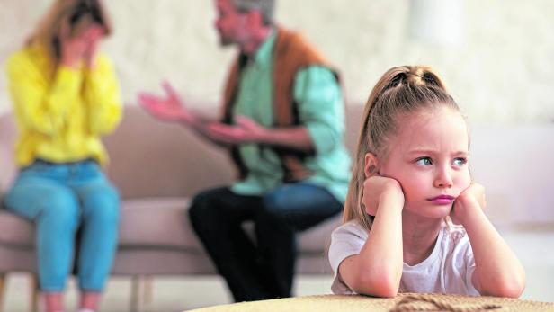 Parents Having Quarrel While Unhappy Little Daughter Sitting At Home