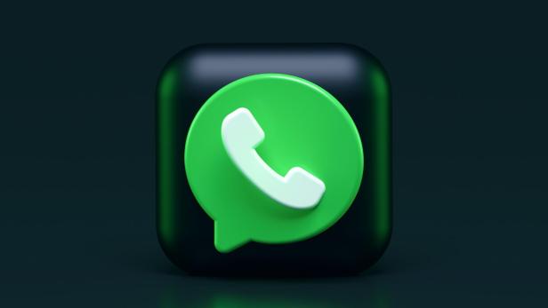 Das WhatsApp-Logo auf einem schwarzen, abgerundeten Quadrat.