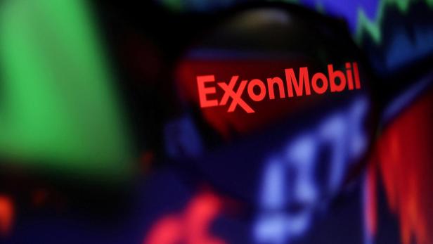 FILE PHOTO: FILE PHOTO: Illustration shows Exxon Mobil logo and stock graph